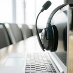 laptop on desk with headset